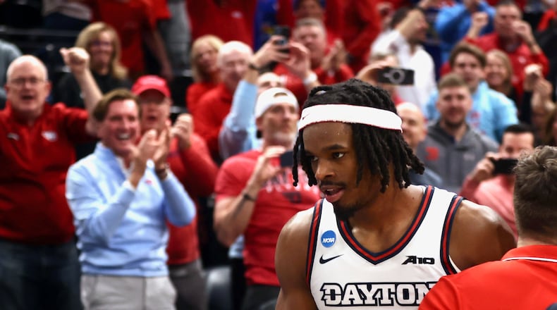Dayton's DaRon Holmes II heads to the postgame handshake line after a victory against Nevada in the first round of the NCAA tournament on Thursday, March 21, 2024, at the Delta Center in Salt Lake City, Utah. David Jablonski/Staff