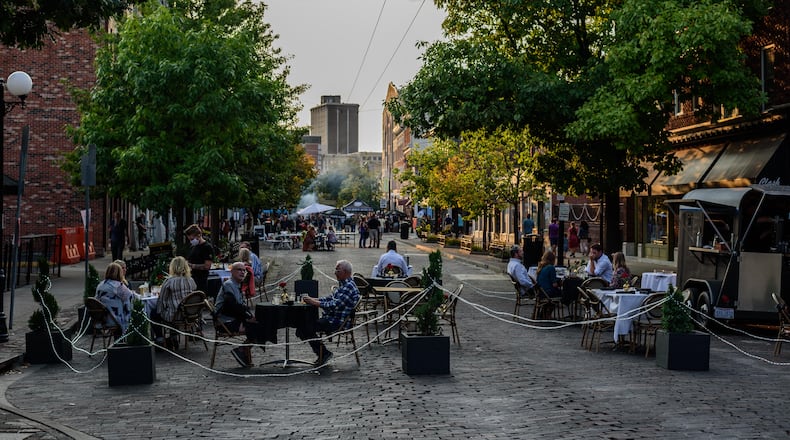 Out on 5th in The Oregon District. Fifth Street will be closed to vehicle traffic on the weekends until the end of October to allow for expanded outdoor seating, sidewalk sales and musical entertainment. TOM GILLIAM/CONTRIBUTING PHOTOGRAPHER