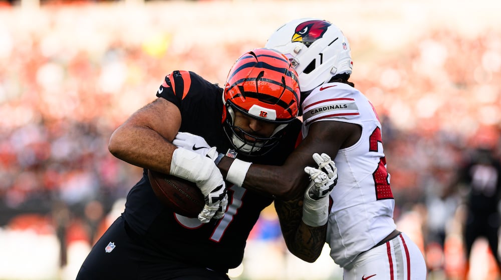 Bengals offensive lineman Cody Ford completes a catch and run in the third quarter during their game against the Arizona Cardinals on Sunday, Dec. 28, at Paycor Stadium. JEREMY MILLER / CONTRIBUTED PHOTO