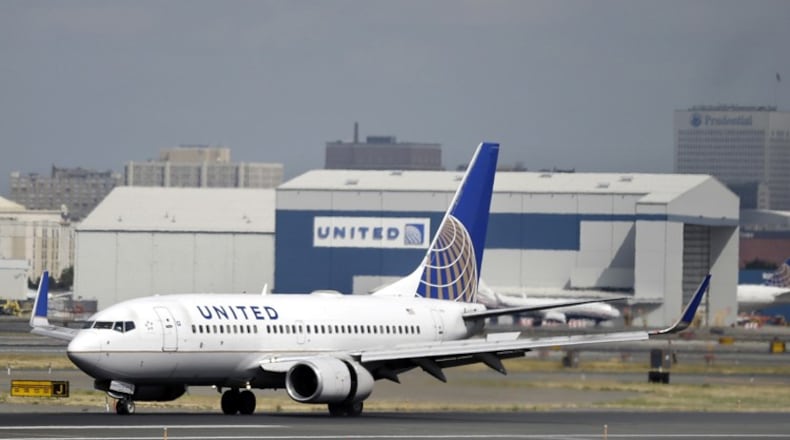 In this Sept. 8, 2015, file photo, a United Airlines passenger plane lands at Newark Liberty International Airport in Newark, N.J. United said on Monday, March 27, 2017, that regular-paying fliers are welcome to wear leggings aboard its flights, even though two teenage girls were barred by a gate agent from boarding a flight from Denver to Minneapolis Sunday because of their attire. (AP Photo/Mel Evans, File)