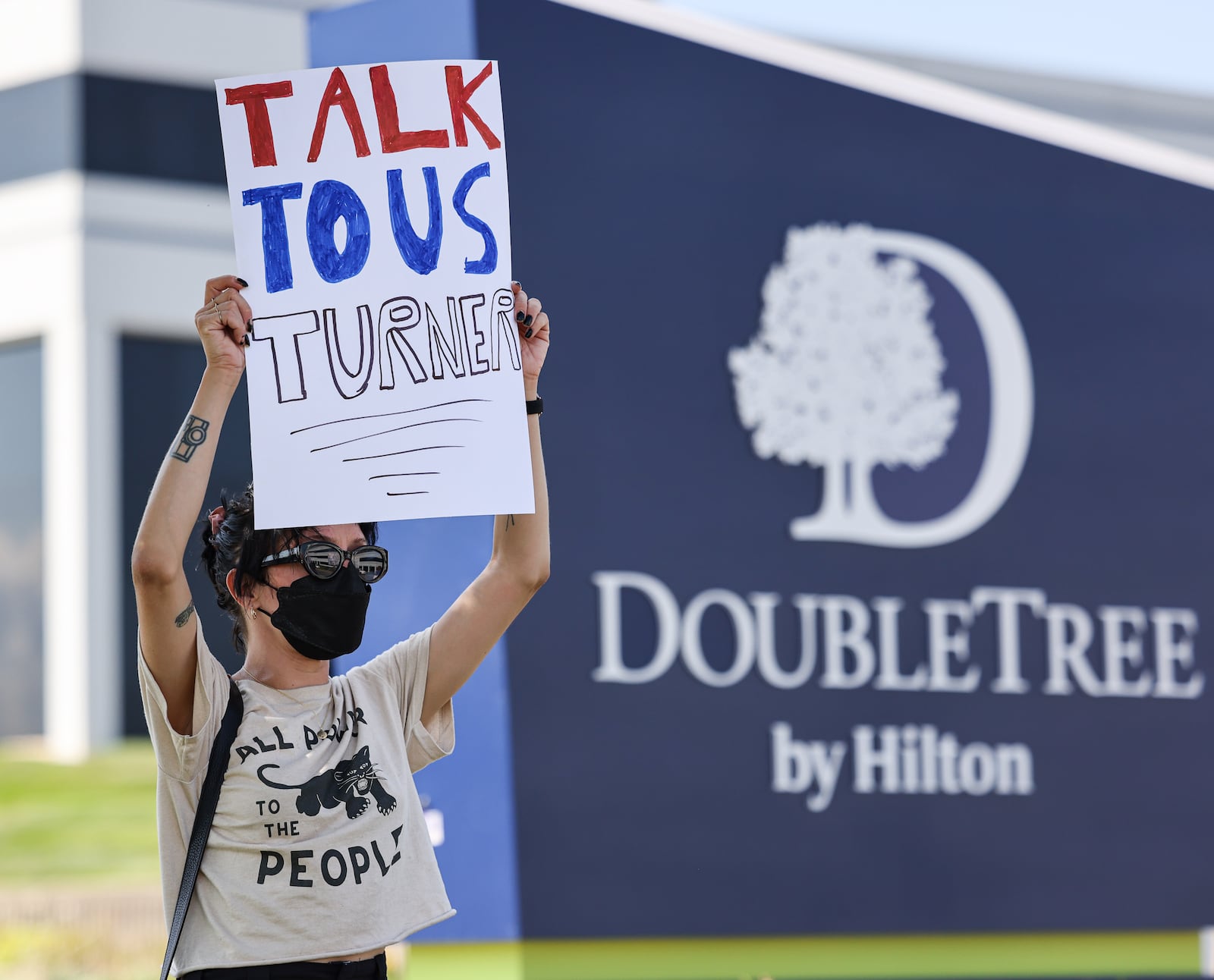 Demonstrators gathered on Thursday on the sidewalk along Presidential Drive in Fairborn near Wright State University in front of a DoubleTree by Hilton that U.S. Rep. Mike Turner (R-Dayton) was scheduled to speak at during a meeting with a defense trade group. Demonstrators were holding signs criticizing Turner for not hosting town halls or public meetings. BRYANT BILLING / STAFF