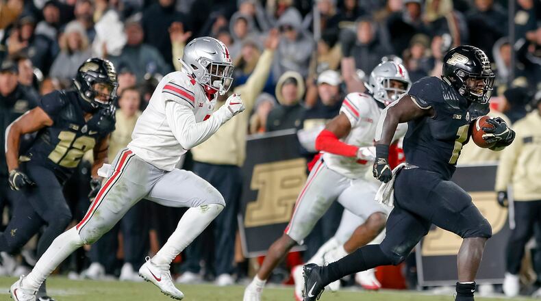 D.J. Knox of the Purdue Boilermakers runs for a touchdown as Jordan Fuller of the Ohio State Buckeyes pursues at Ross-Ade Stadium last season in West Lafayette, Indiana. (Photo by Michael Hickey/Getty Images)
