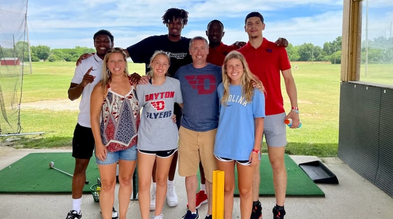 Dayton basketball players (left to right in back) Malachi Smith, DaRon Holmes II, R.J. Blakney and Koby Brea pose for a photo with fans at Young's Jersey Dairy in June 2022 in Yellow Springs. Contributed photo