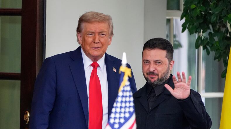 FILE - President Donald Trump, left, greets Ukraine's President Volodymyr Zelenskyy as he arrives at the White House, Aug. 18, 2025, in Washington. (AP Photo/Alex Brandon, File)