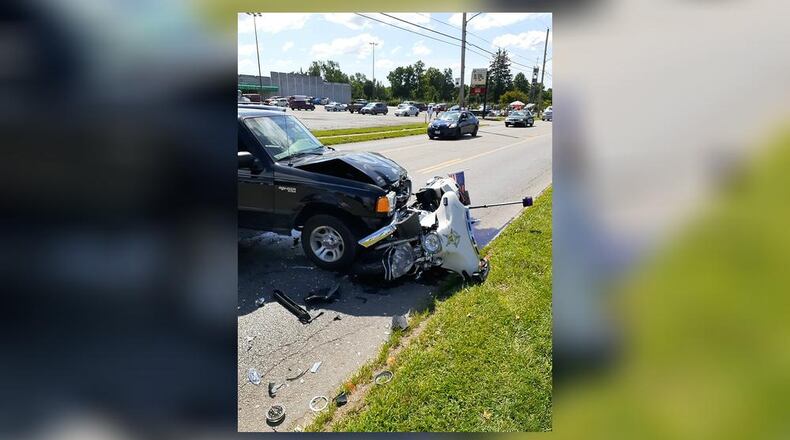 A motorcycle escort officer was hit Saturday during a funeral procession in Hamilton