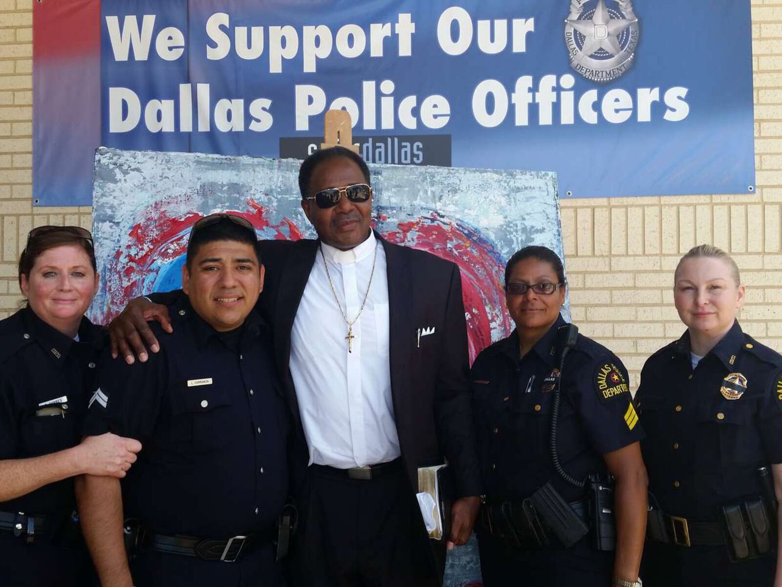 The Rev. J.D. Grigsby with Dallas police offers earlier this month. CONTRIBUTED PHOTO