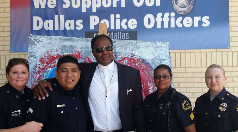 The Rev. J.D. Grigsby with Dallas police offers earlier this month. CONTRIBUTED PHOTO