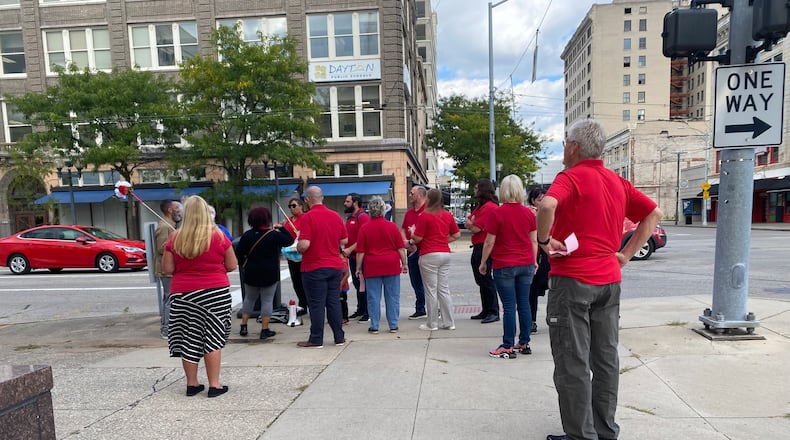 Members of the Dayton Education Association protest on South Ludlow Street near the Dayton Public School's headquarters in September. Eileen McClory / staff