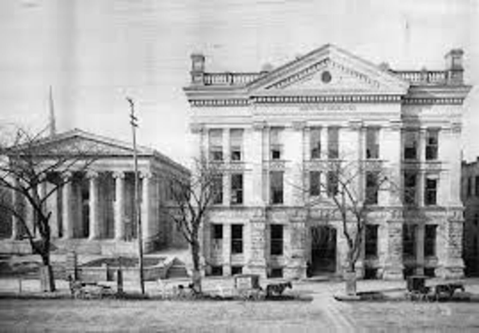 The Old Montgomery County Courthouse, left, with the 'new Montgomery County Courthouse beside it.