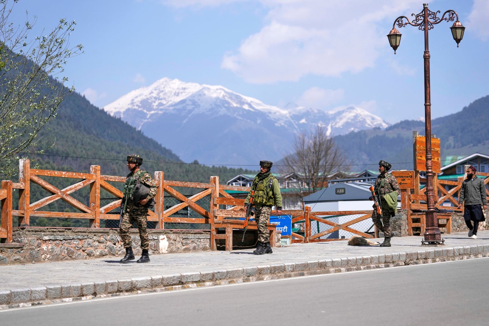 Security personnel patrol a street the morning after militants indiscriminately opened fire on tourists near Pahalgam in Indian controlled Kashmir, Wednesday, April 23, 2025. (AP Photo/Dar Yasin)