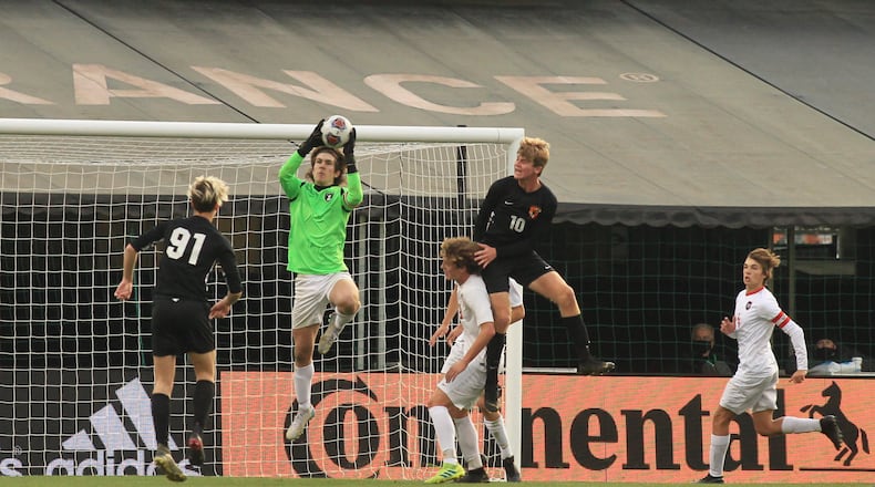 Tippecanoe's Clay Vaughn makes a save in the first half against Warren Howland in the Division II state championship game on Saturday, Nov. 14, 2020, at MAPFRE Stadium in Columbus. David Jablonski/Staff