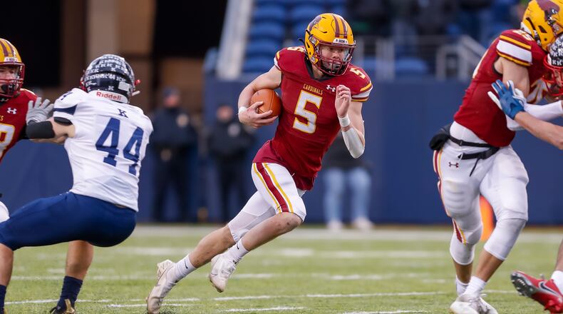 New Bremen High School senior quarterback David Homan runs the ball during the Division VII state title game against Warren JFK on Saturday, Dec 3 at Tom Benson Hall of Fame Stadium in Canton. The Cardinals won 38-6. CONTRIBUTED PHOTO BY MICHAEL COOPER