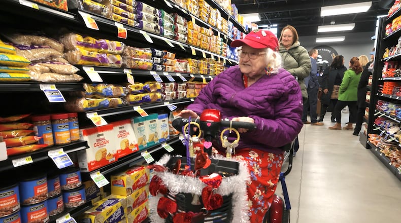 Dolores Walker shops at the Gettysburg Grocery Thursday, Feb. 6, 2025. The grocery is part of Homefull’s Healthy Living West Dayton project which held its grand opening Thursday. BILL LACKEY/STAFF