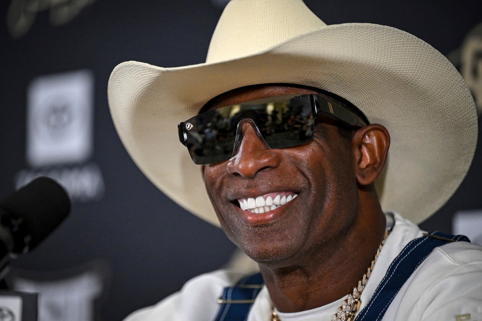 Colorado head coach Deion Sanders smiles before speaking about his journey in beating bladder cancer during a press conference Monday, July 28, 2025, in Boulder, Colo. (AAron Ontiveroz/The Denver Post via AP)