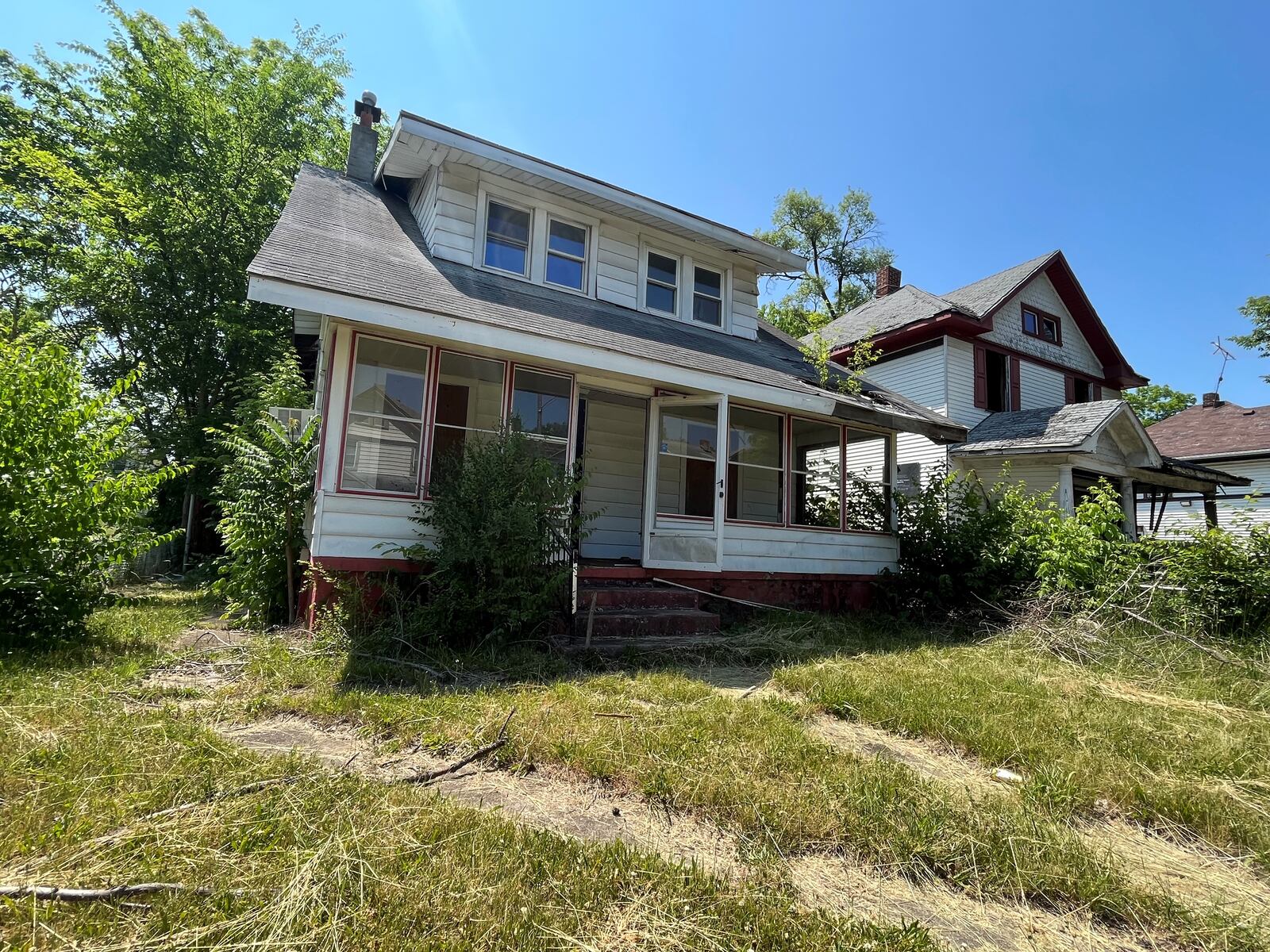 A vacant home in West Dayton that owes delinquent taxes. CORNELIUS FROLIK / STAFF