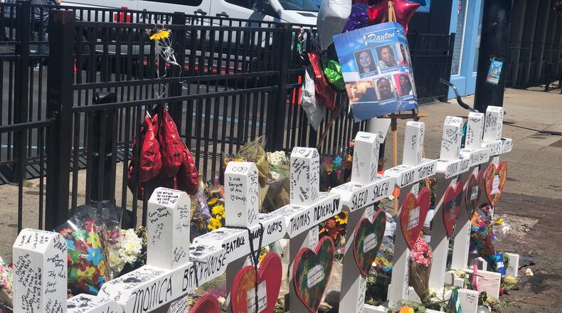 The memorial to the nine people killed in the Aug. 4 shooting in the Oregon District. Three victims had their birthdays in September. CORNELIUS FROLIK / STAFF