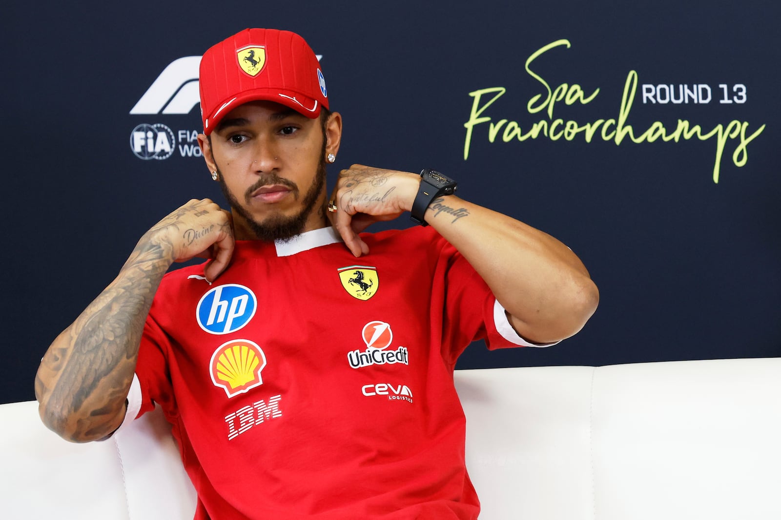 Ferrari driver Lewis Hamilton of Britain attends a media conference ahead of the Formula One Grand Prix at the Spa-Francorchamps racetrack in Spa, Belgium, Thursday, July 24, 2025. (AP Photo/Geert Vanden Wijngaert)