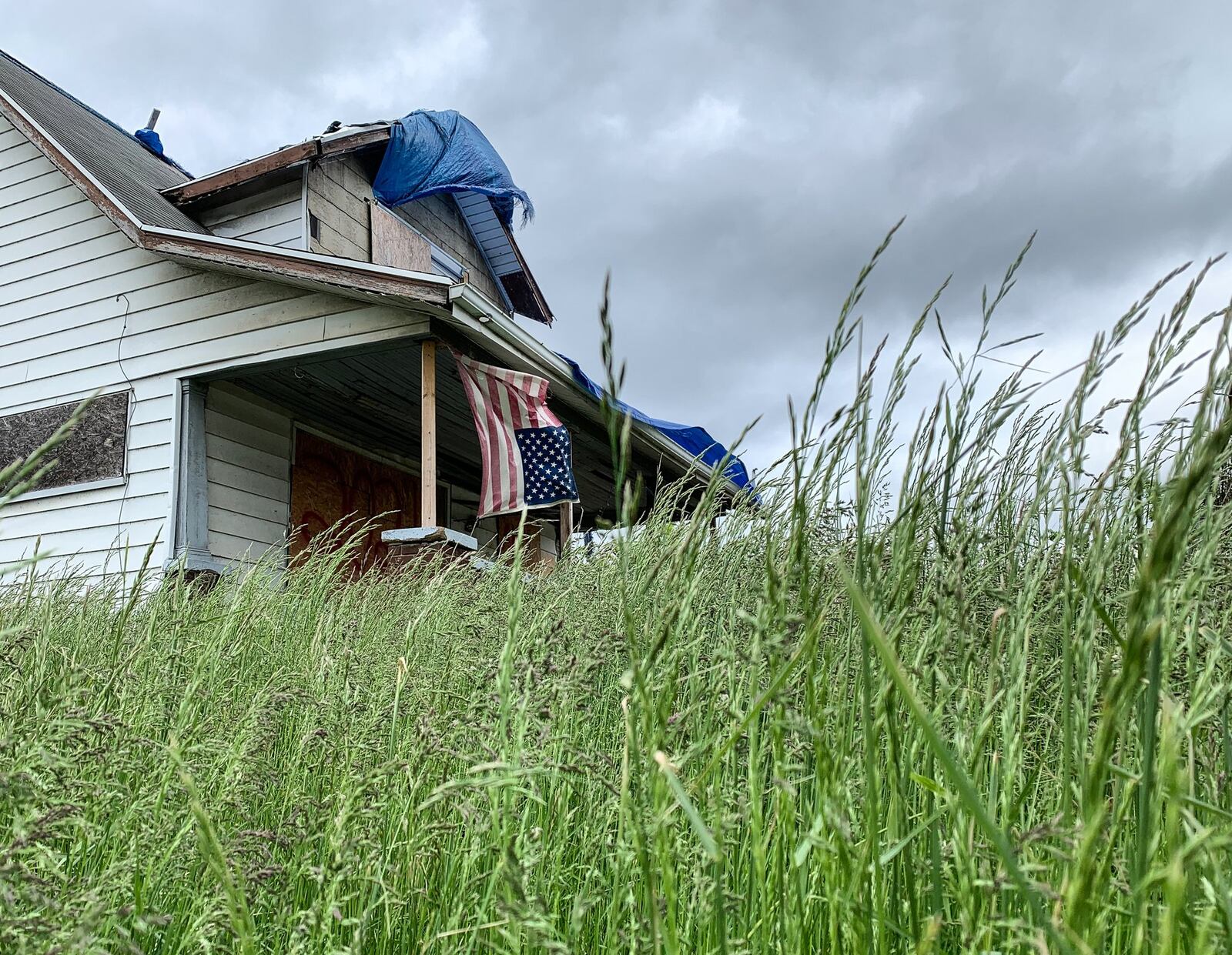 Damaged in last year's Memorial Day tornadoes, this house on Maplegrove Avenue in Harrison Twp. is one of five on the street slated to be removed through funds from a FEMA program, according to the township. CHRIS STEWART / STAFF