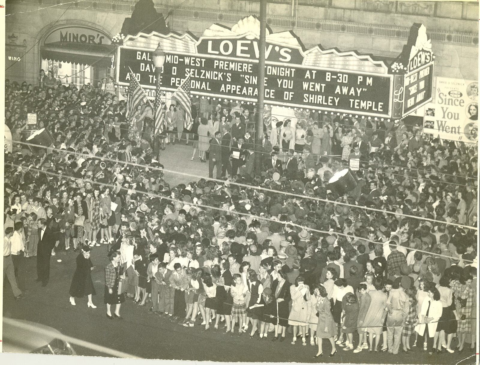 A crowd fills the sidewalk outside the old Loew's Theater on North Main Street in Dayton. The marquee lists a showing of "Since You Went Away," which was released in 1944, and a personal appearance by Shirley Temple, who had a role in the movie.