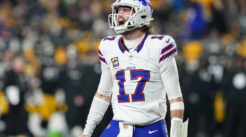 Buffalo Bills quarterback Josh Allen (17) celebrates after a touchdown during the second half of an NFL football game against the Pittsburgh Steelers Sunday, Nov. 30, 2025, in Pittsburgh. (AP Photo/Matt Freed)