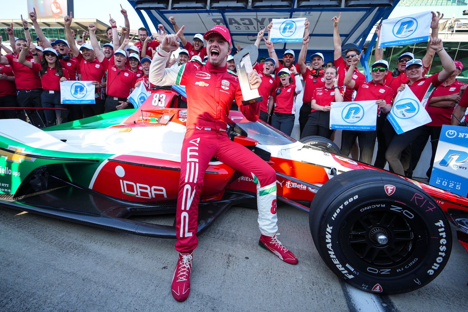 Robert Shwartzman, of Israel, celebrates after winning the pole position during qualifications for the Indianapolis 500 auto race at Indianapolis Motor Speedway in Indianapolis, Sunday, May 18, 2025. (AP Photo/Michael Conroy)