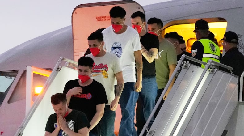 FILE - Migrants deported months before by the United States to El Salvador under the Trump administration's immigration crackdown arrive at Simon Bolívar International Airport in Maiquetia, Venezuela, July 18, 2025. (AP Photo/Ariana Cubillos, File)