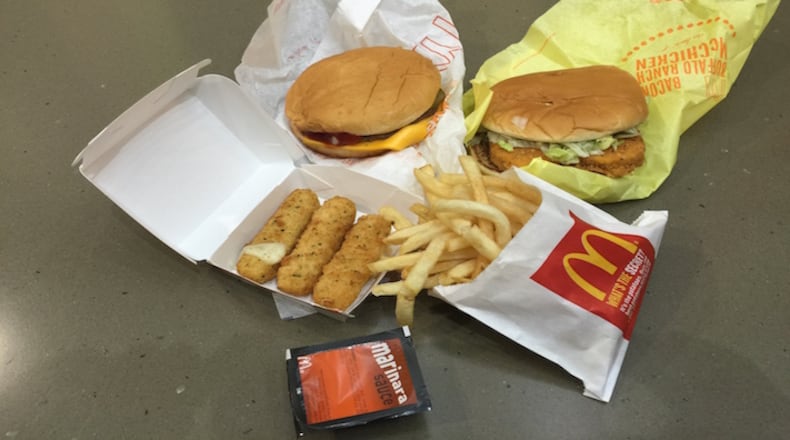 This Monday, Jan. 4, 2016, photo, shows a "McPick 2 for $2" deal at a McDonald's restaurant in New York. Another price fight is breaking out among the country's biggest burger chains, this time with meal combos designed to make people forget about the once ubiquitous dollar menus. (AP Photo/Candice Choi)