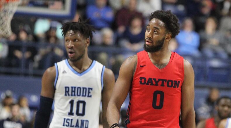 Dayton’s Josh Cunningham heads back down the court during a game against Rhode Island on Saturday, Feb. 9, 2019, at the Ryan Center in Kingston, R.I. David Jablonski/Staff