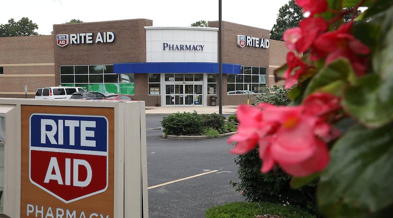 Rite Aid is cutting 400 full-time jobs and three its top leaders are leaving the company. BILL LACKEY/STAFF