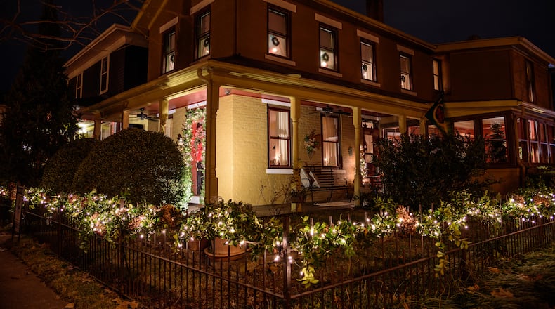 Residents of the Oregon Historic District opened their doors to the city of Dayton for the neighborhood’s annual Candlelight Holiday Tour on Dec. 3-5. Six lavishly decorated residences participated in this year’s tour, including this year’s dessert house constructed by stepladder inventor John H. Balsley more than 140 years ago. TOM GILLIAM / CONTRIBUTING PHOTOGRAPHER
