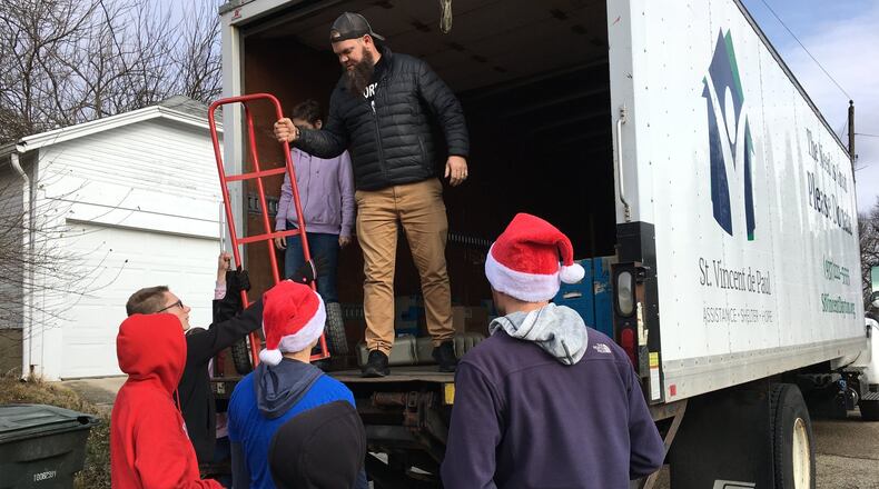 Living City Project organized volunteers Saturday to move furniture into homes of people displaced by the Memorial Day tornadoes. Staff photo / Sarah Franks