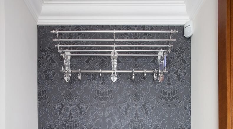 Wallpaper or mirror the back wall of your closet for some extra pizzazz. (Dreamstime)