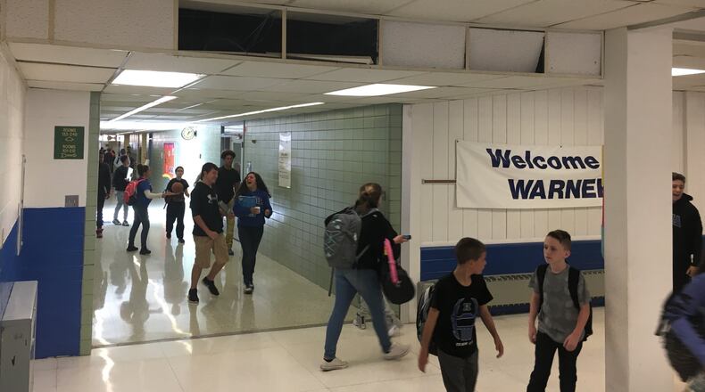 Students at Warner Middle School in Xenia walk past outdated heating vents, nonworking clocks and damaged ceilings Tuesday, Oct. 11, 2016. Xenia Community Schools is asking voters to approve a bond issue Nov. 8 that would pay to replace the district’s middle school and high school. JEREMY P. KELLEY / STAFF