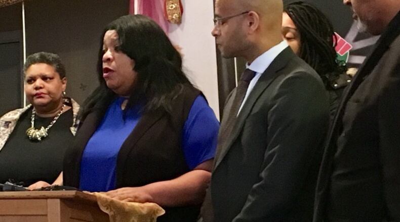 Sabrina Jordan (second from left), the mother of Jamarco McShann, speaks during a March press conference about the wrongful death lawsuit filed in Dayton’s U.S. District Court. McShann was shot and killed last year by Moraine police, who said McShann did not respond to messages to drop a weapon. McShann had been asleep in his car. To Jordan’s left is her attorney, Andrew Stroth. STAFF/MARK GOKAVI