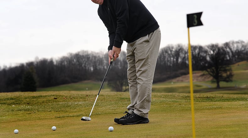 Tim Lane practices his putting Tuesday Jan. 10, 2023 at the Community Golf Course in Kettering. Lane said anytime the temperature was over 40 degrees he is out practicing his putting. MARSHALL GORBY\STAFF