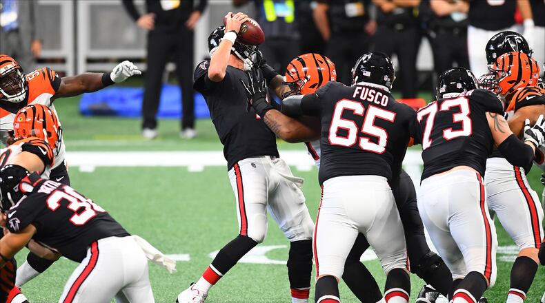 ATLANTA, GA - SEPTEMBER 30: Matt Ryan #2 of the Atlanta Falcons is sacked by Carl Lawson #58 of the Cincinnati Bengals during the third quarter at Mercedes-Benz Stadium on September 30, 2018 in Atlanta, Georgia. (Photo by Scott Cunningham/Getty Images)
