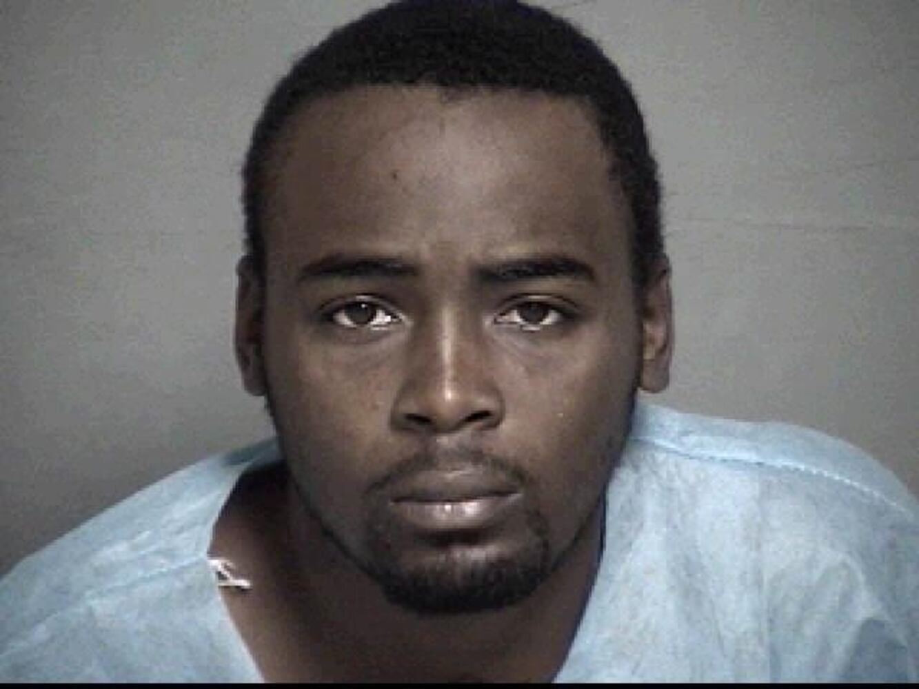 Police shoot suspect from hood of moving car