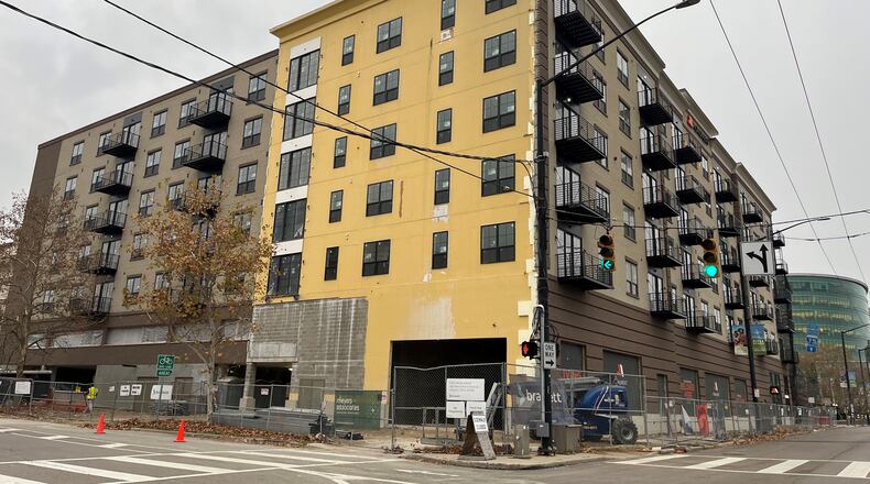 A new apartment project under construction along Monument Avenue called The Monument, across from RiverScape MetroPark. CORNELIUS FROLIK / STAFF