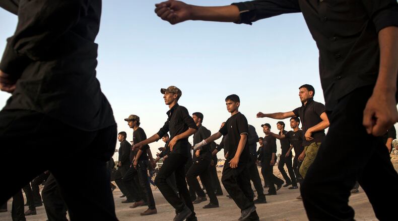 Civilian volunteers during military training to assist Shiite militias loyal to Iran in Kufa, southern Iraq, on June 20, 2014. Qasem Soleimani, the powerful and shadowy spymaster at the head of Irans security machinery, was killed in an American drone strike in Baghdad on early on Friday, Jan. 3, 2020. (Lynsey Addario/The New York Times)