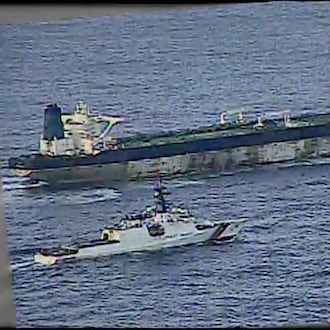 This image from video provided by the U.S. Department of Defense, shows the U.S. Coast Guard cutter Munro shadowing the MV Bella 1 in the North Atlantic Ocean during the maritime interdiction operation Wednesday, Jan. 7, 2026. (Department of Defense via AP)