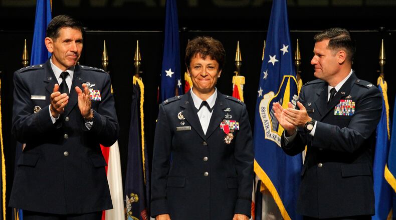 Col. Cassie Barlow, former Wright-Patterson Air Force Base commander, is among the 2018 inductees to the Ohio Veterans Hall of Fame. Barlow was replaced by Col. John Devillier (right), following her retirement from the Air Force. LISA POWELL/FILE
