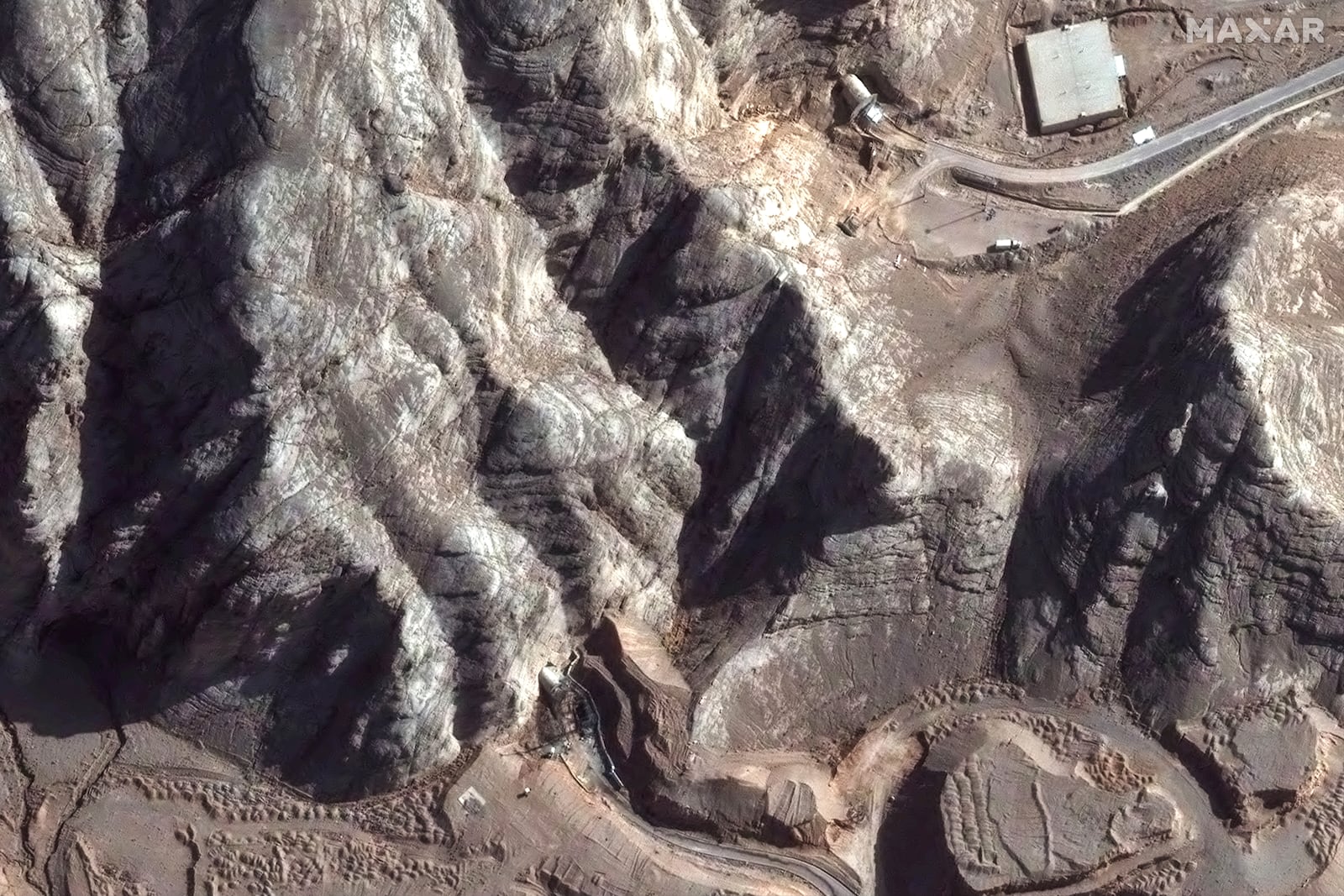 This Tuesday, June 24, 2025, satellite image provided by Maxar Technologies shows tunnel entrances at Isfahan Nuclear Technology Center in Iran after recent airstrikes. (Maxar Technologies via AP)