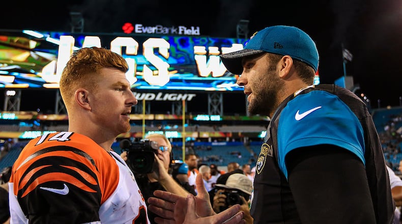 JACKSONVILLE, FL - AUGUST 28: Andy Dalton #14 of the Cincinnati Bengals and Blake Bortles #5 of the Jacksonville Jaguars shake hands after the preseason game at EverBank Field on August 28, 2016 in Jacksonville, Florida. (Photo by Rob Foldy/Getty Images)