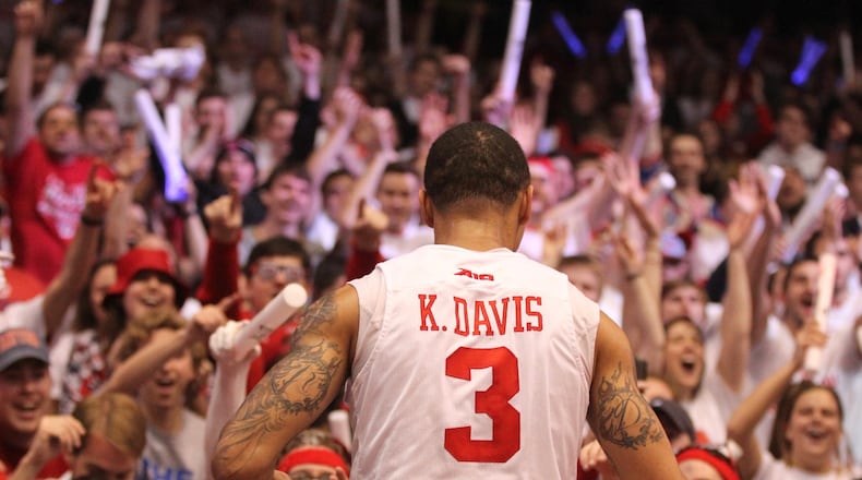 Dayton's Kyle Davis jumps into the student section after a victory against Virginia Commonwealth on March 1, 2017, at UD Arena.