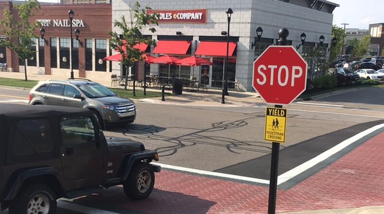 Striped crosswalks are among the work at Austin Landing designed to improve safety and traffic flow. NICK BLIZZARD/STAFF PHOTO