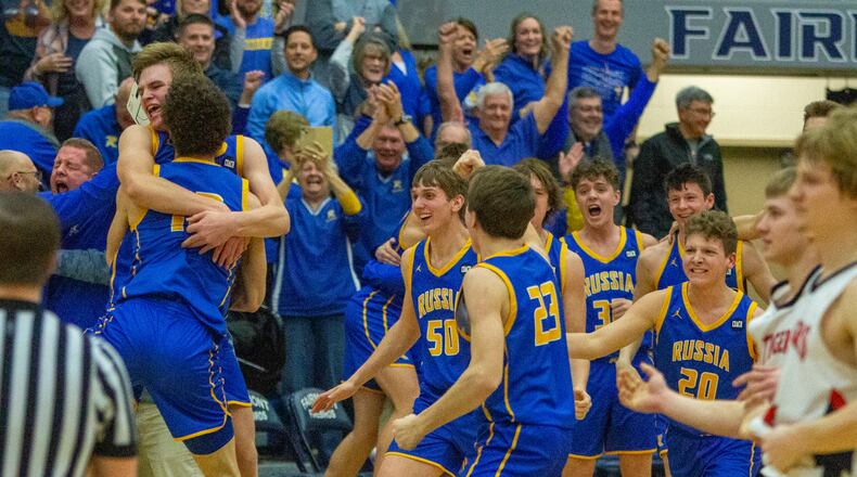 Russia’s boys basketball team celebrates its 27-25 victory over Jackson Center in the Region IV final at Trent Arena in Kettering on Friday, March 10, 2023. CONTRIBUTED/Jeff Gilbert