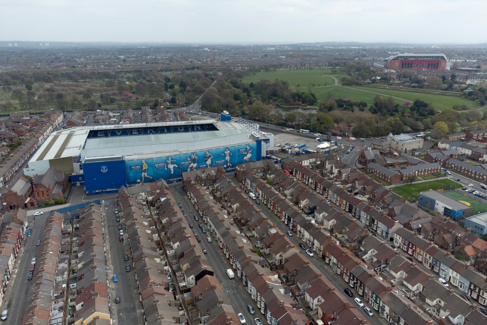 FILE - Everton's Goodison Park Stadium is seen with Liverpool's Anfield Stadium in the background, in Liverpool, England, Wednesday, April 21, 2021. (AP Photo/Jon Super, File)