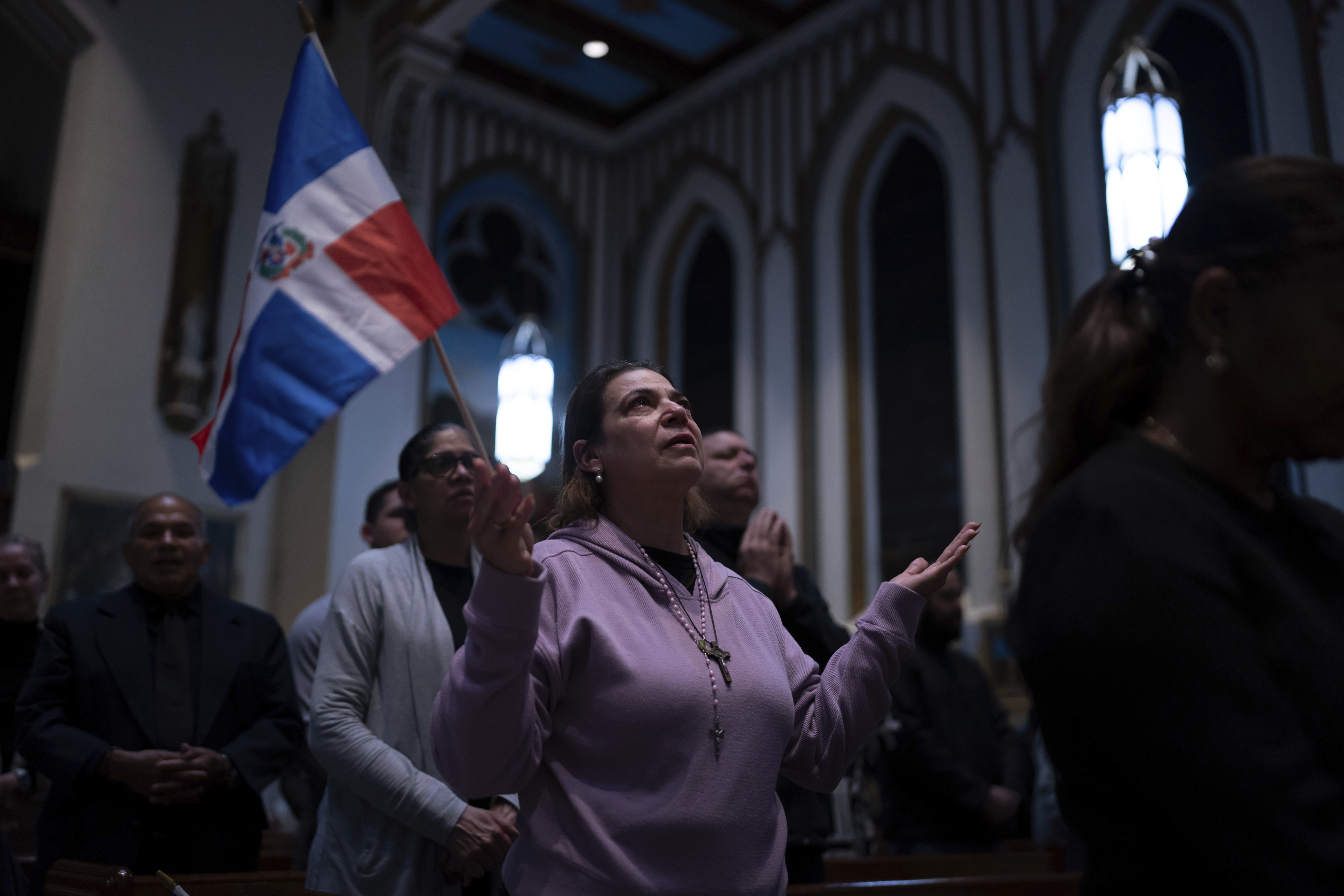 People attend a Mass for the victims of the Jet Set club roof collapse at St. Elizabeth's Church, Wednesday, April 9, 2025 in New York. (AP Photo/Adam Gray)