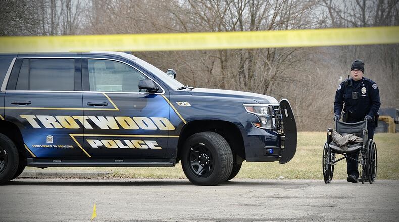 Trotwood police and search teams are investigating on Covenant House Drive Tuesday, March 8, 2022. MARSHALL GORBY / STAFF