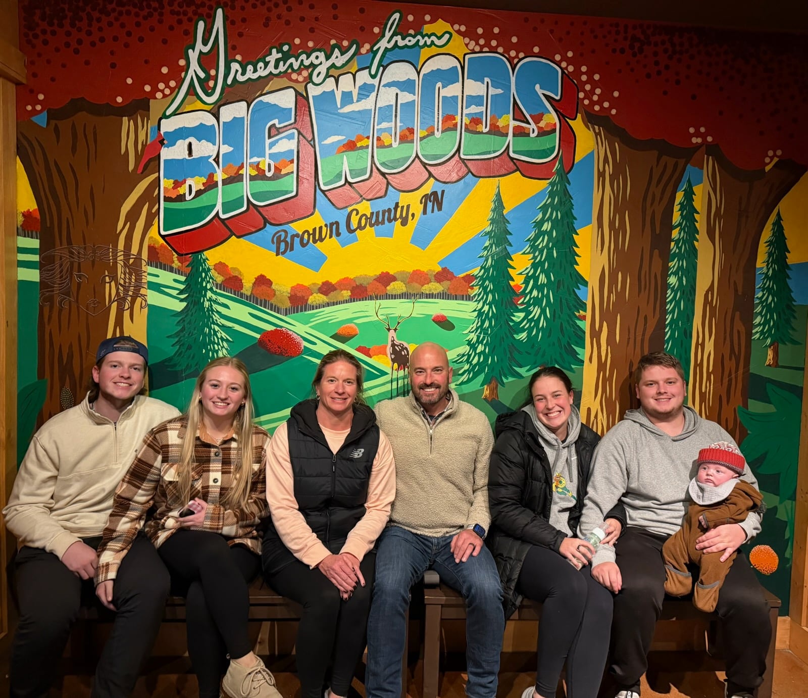 Matt Brown in a gathering of his family in Brownsburg, Indiana three weeks ago (left to right): son Alex and his girlfriend Chloe Britton; wife Ellen and Matt, son Logan on right next to fiancé Mia Andrews-Pope and their two-month old son Wyatt on his knee. CONTRIBUTED PHOTO